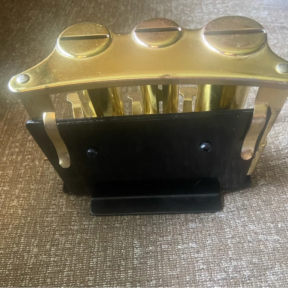 Vintage retro brass metal mechanical bank coin changer stand Black metal stand